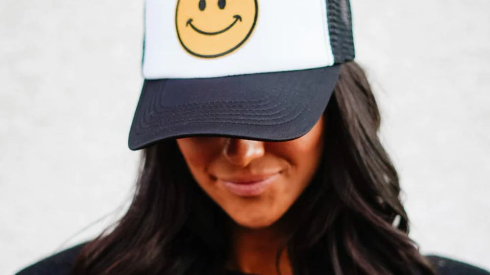 3 Ways To Elevate Your Outfit With a Trucker Hat